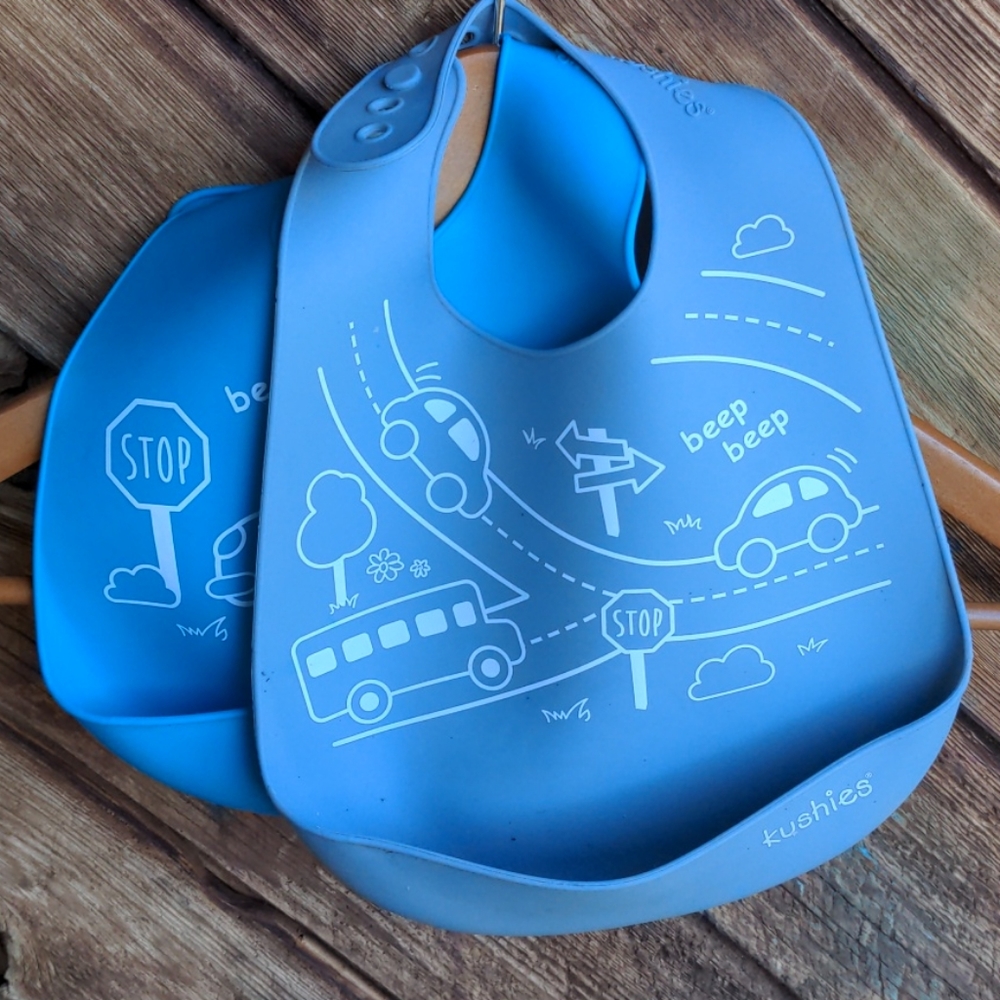Pair of blue & grey Kushies silicone bibs
